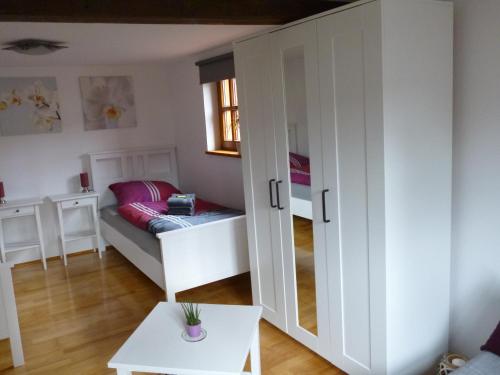 a small room with a bed and a window at Ferienwohnung Jansen "Eins" in Bad Schwalbach