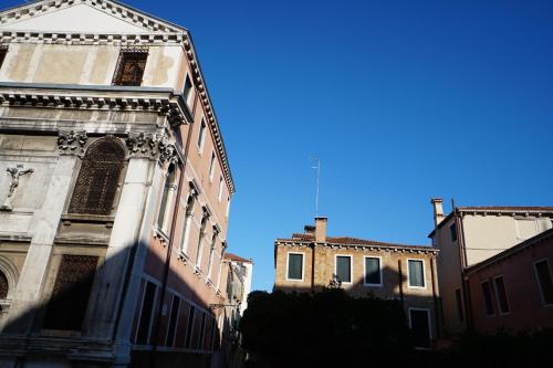 a group of buildings with a blue sky in the background at P 1779 in Venice