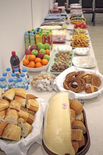 a long table filled with different types of food at Pera City Hotel in Ankara