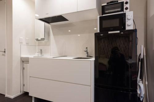 Kuchyň nebo kuchyňský kout v ubytování House In Azabu