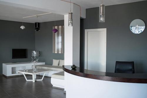 a living room with a couch and a table at Aeri in Chora Folegandros