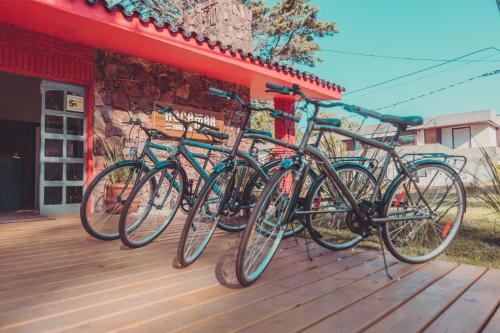a group of bikes parked next to a building at RocaMar Hostel Boutique in Punta del Este