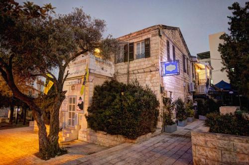 a building with a clock on the side of it at City Port Hotel in Haifa