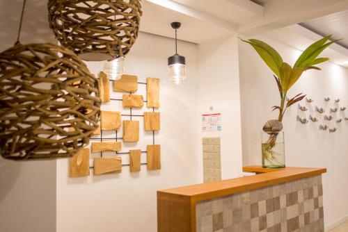 a room with wooden blocks hanging on the wall at Velana Beach Hotel Maldives in Maafushi