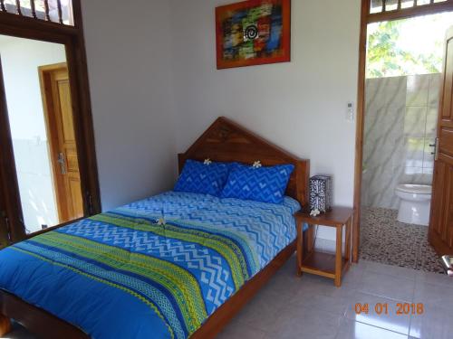 Ένα ή περισσότερα κρεβάτια σε δωμάτιο στο Murnis Bungalow