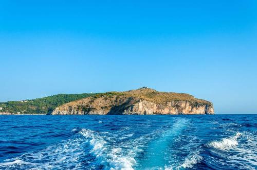 an island in the middle of a body of water at Residence Da Carmelo in Palinuro