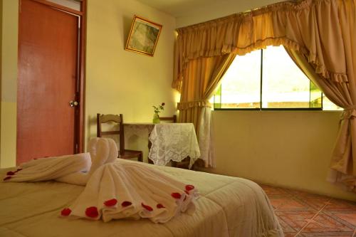 Postel nebo postele na pokoji v ubytování hotel MISKY PUÑUY - Valle del Sondondo
