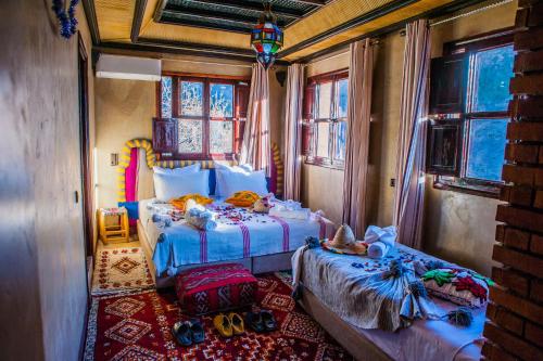 Postel nebo postele na pokoji v ubytování Toubkal Ecolodge