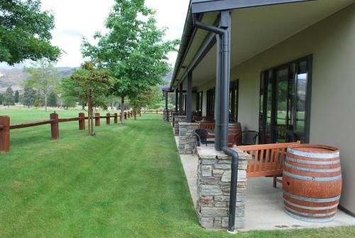 a group of benches sitting outside of a building at Carrick Lodge Motel in Cromwell