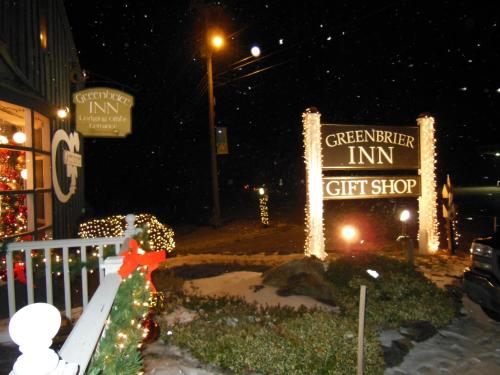 a sign for a gift shop with christmas lights at Greenbrier Inn Killington in Killington