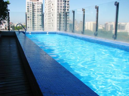 a large swimming pool on top of a building at Sinclair Trinidad in Buenos Aires