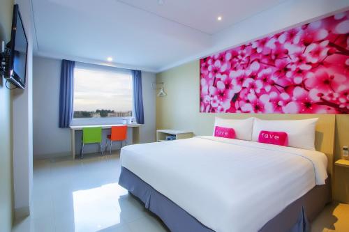เตียงในห้องที่ d'primahotel Balikpapan