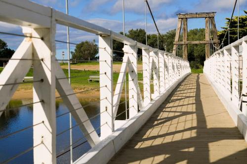 a bridge over a body of water at Mantra Lorne in Lorne