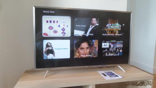a flat screen tv sitting on top of a table at Whitehorse Towers Self Service Holiday Apartment in Box Hill