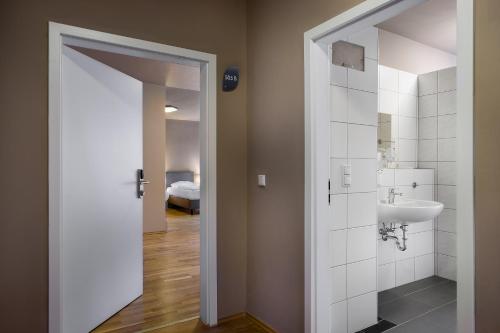 Ванная комната в Munique Hotel Frankfurt City