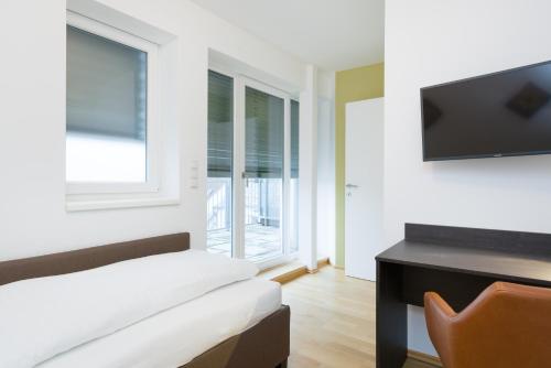 Телевизор и/или развлекательный центр в Vienna Stay Apartments Pezzl 1170