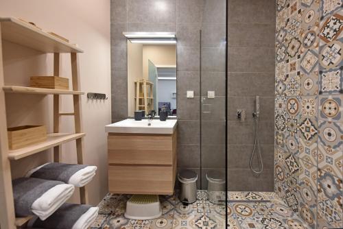 a bathroom with a shower and a sink at Apartment Tivoli Park in Ljubljana