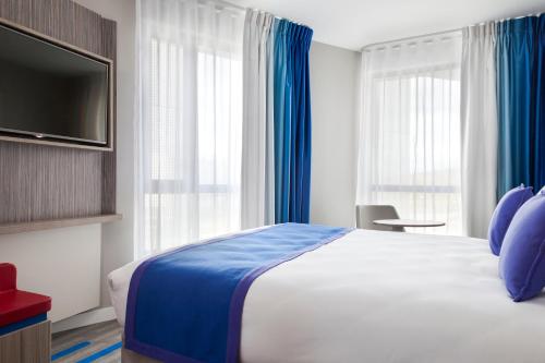Una cama o camas en una habitación de Mercure Toulouse Sud