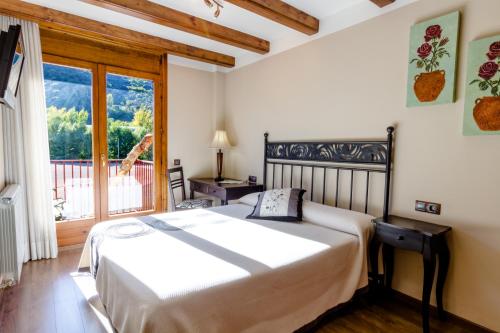 
Cama o camas de una habitación en Hotel Flor De Neu
