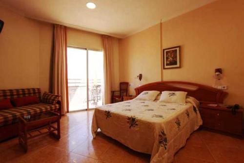 Postel nebo postele na pokoji v ubytování Hotel Paloma