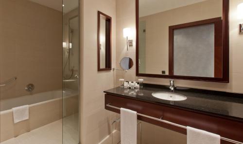 a bathroom with two sinks and a mirror at Hotel Barcelona Center in Barcelona