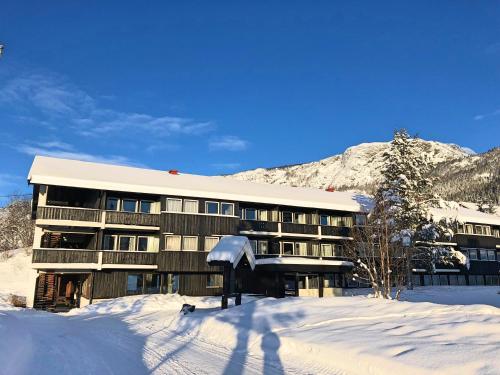 a building with snow in front of it at Storehorn Apartments in Hemsedal