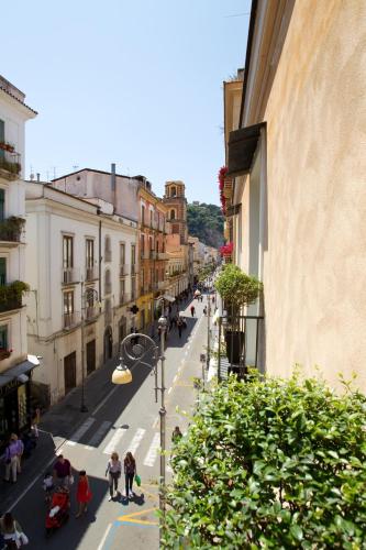 a view of a street with people walking down a street at Palazzo Montefusco in Sorrento
