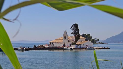 a church on a island in the middle of the water at Egrypos Hotel in Petrití