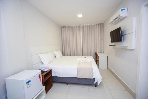 Postel nebo postele na pokoji v ubytování Hotel Portal Guanambi