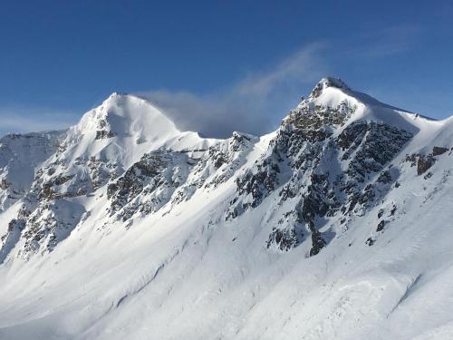 a mountain covered in snow on top at Ferienwohnung Fionas 267 in Ftan