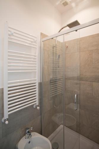 a bathroom with a shower and a sink at La Maison Extravagante in Saronno