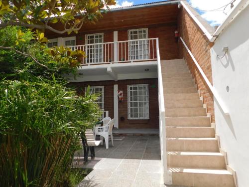 a stairway leading to the front of a house at Hostería Teuly in Puerto Madryn