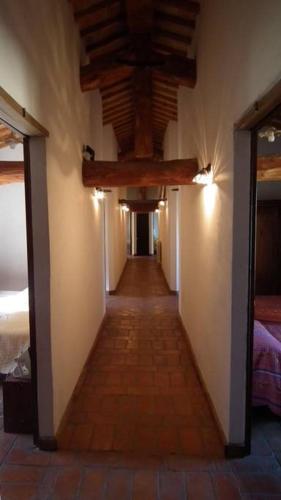 a hallway of a room with a ceiling and a hallwayngthngthngthngthngth at B&B Alsoci-La Tasca in Marsciano