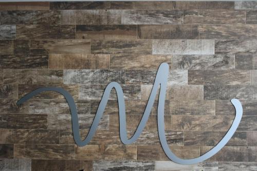 a sign that says no on a wood floor at California Comfort & Suites in Los Algodones
