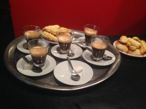 a tray with drinks and food on a table at Maison d'Hôtes Irocha in Tisselday