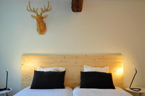 Ένα ή περισσότερα κρεβάτια σε δωμάτιο στο Hotel Beez