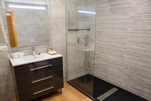 a bathroom with a sink and a shower at Hr Mirador in Canillas de Albaida
