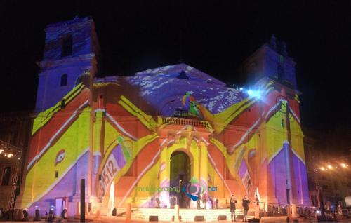 a church lit up at night with lights at Valletta Harbour View Apartment in Valletta