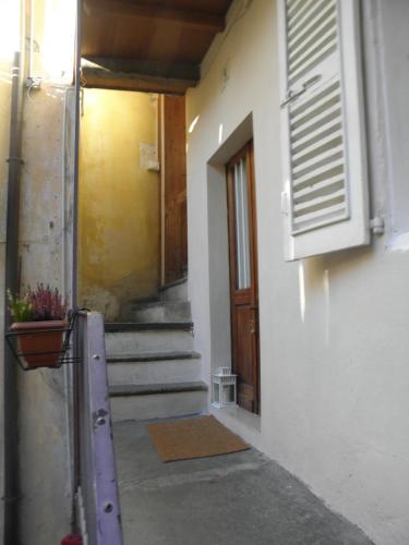 a hallway with stairs and a door to a building at B&B Al Vicolo del Gallo in Varallo