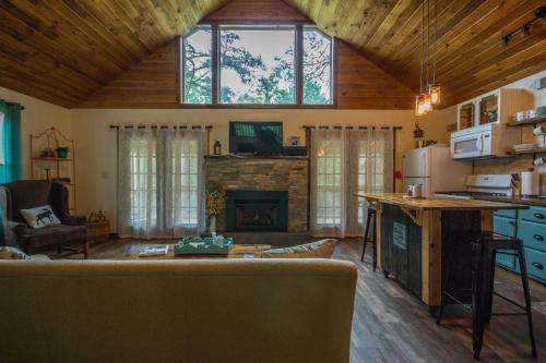 a living room with a couch and a fireplace at Heaven's Hideaway- perfect getaway near the river! in Luray