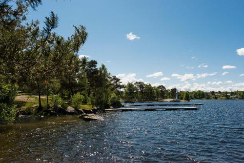 a river with a dock in the middle of it at Partille Vandrarhem in Partille
