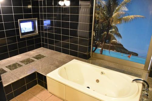Ένα μπάνιο στο Hotel Coco de Palms & Mer (Love Hotel)