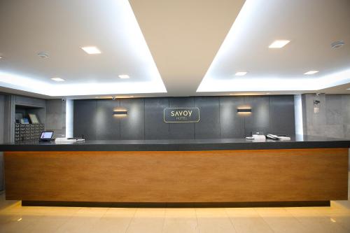 a lobby with a waiting area with a subway sign on the wall at Savoy Hotel Myeongdong in Seoul