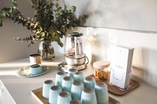 a group of cups on a counter with a blender at The Mitchelton Hotel Nagambie in Nagambie