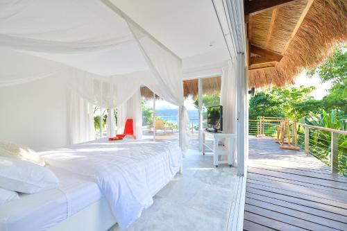 Voodi või voodid majutusasutuse Diniview Villa Resort toas