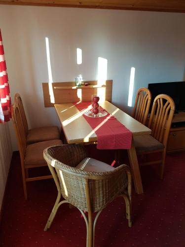 a table and chairs in a room with a table and chairsktop at Appartementhaus Hollaus in Zell am See