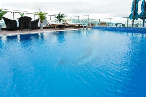 a large blue swimming pool on top of a building at Dana Marina Boutique Hotel in Da Nang