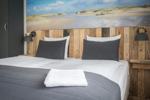 Ein Bett oder Betten in einem Zimmer der Unterkunft Hotel De Waal
