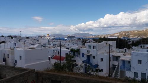 a view of a city with white buildings at Manos Rooms in Mýkonos City