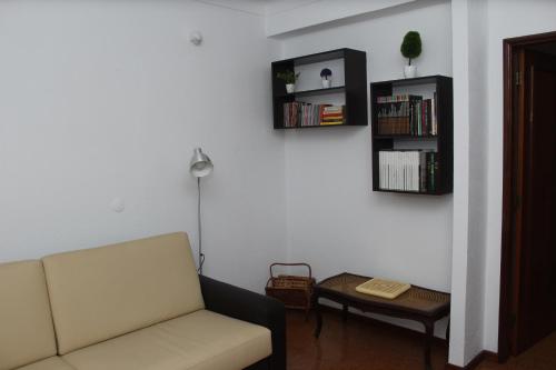 a living room with a couch and a table at Hotel Oasis in Santa Marta de Penaguião